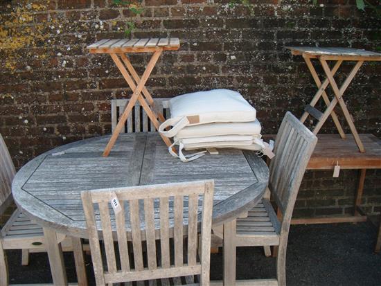 Weathered teak extending garden table, a set of 4 chairs (with cushions), 2 folding tables and another table